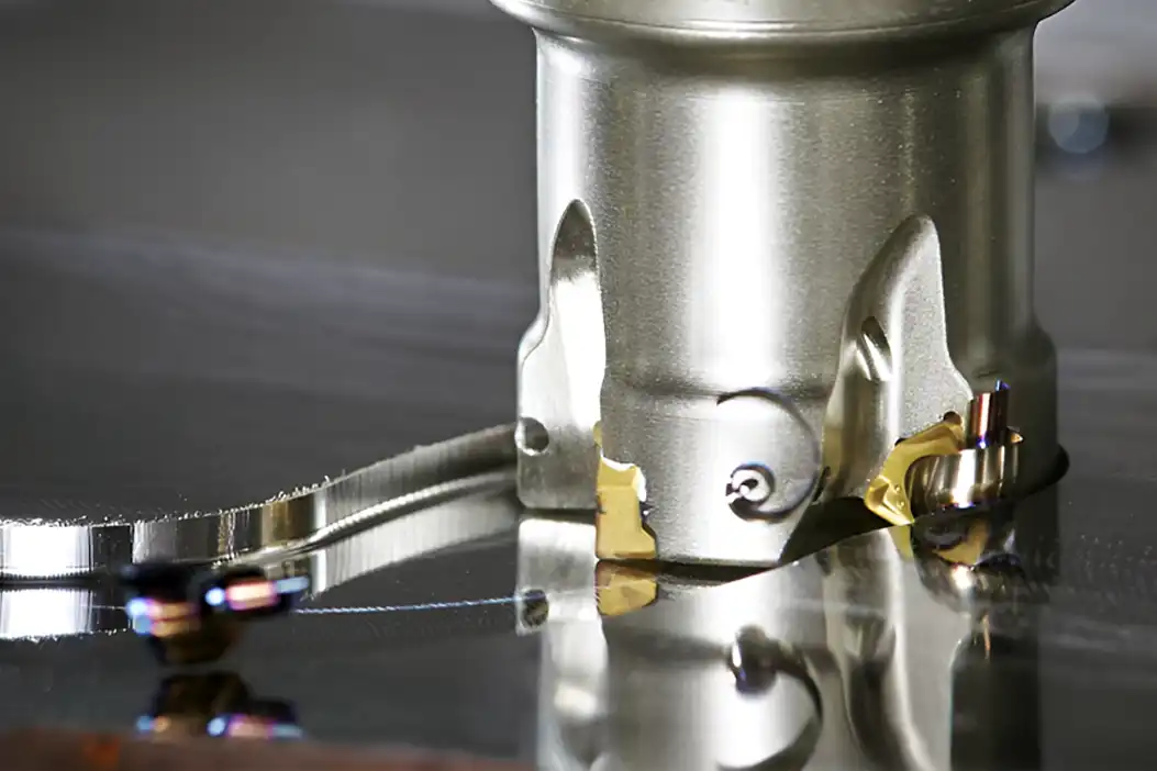 Milling operation using indexable carbide inserts